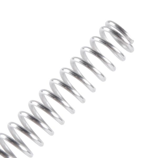 A close-up of a metal spring with a silver finish.