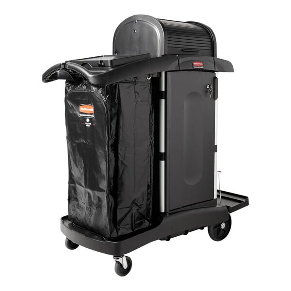 A black Rubbermaid janitor cart with a locking hood, cabinets, and an attached waste bag.
