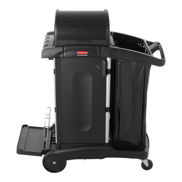 A black Rubbermaid janitor cart with a locking hood, cabinets, and an attached waste bag.