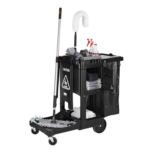 A black janitor cart with a locking cabinet, mop, cleaning supplies, and storage shelves.
