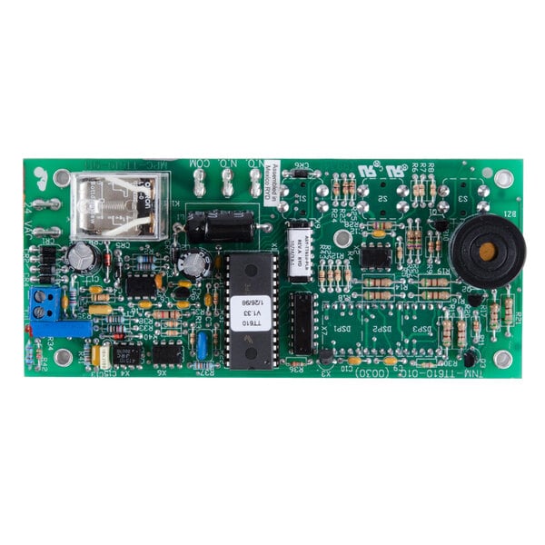 A green Nemco control board with many small components and a white label with black text.