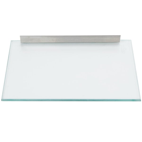 A glass door assembly with a metal bar.