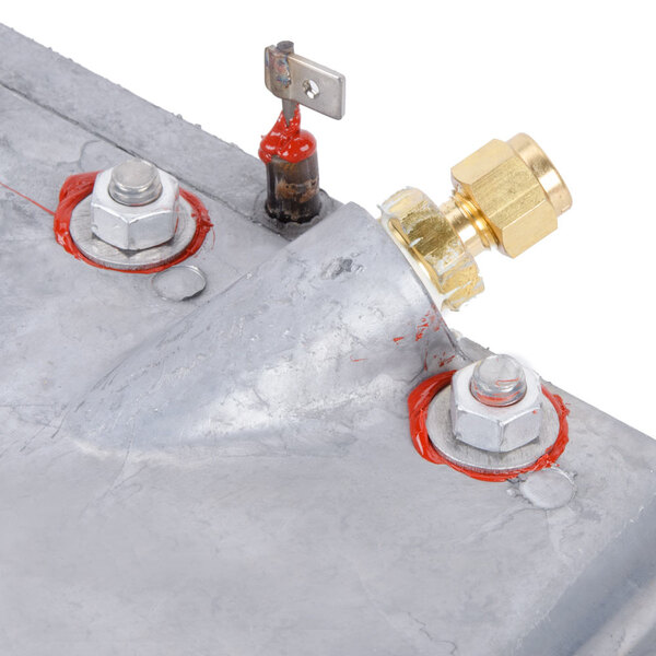 A close-up of a Nemco heater plate assembly with brass nuts.