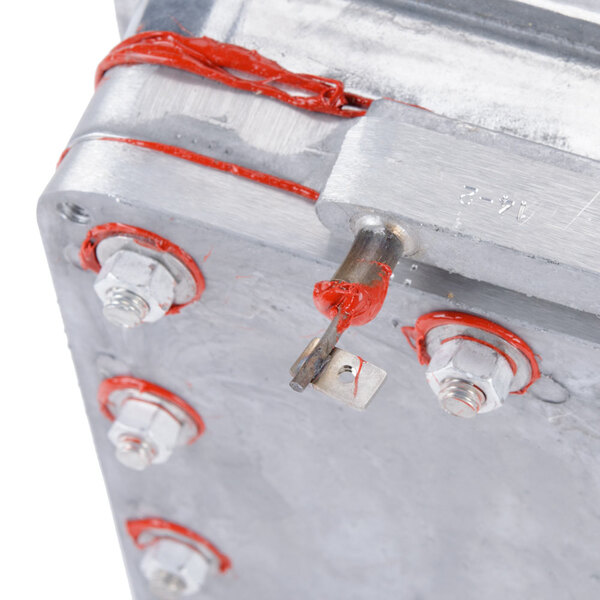 A Nemco heater plate assembly for a countertop rethermalizer with red and silver screws.