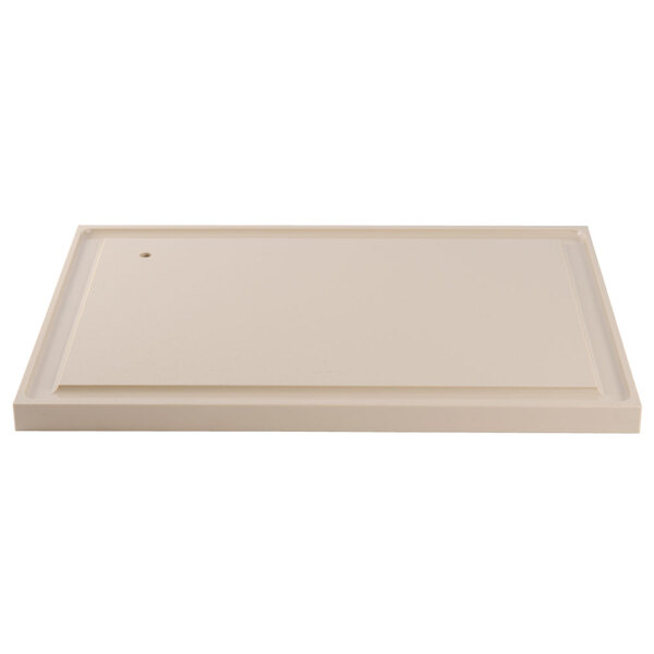 A white rectangular polyethylene carving board with a hole in the middle.