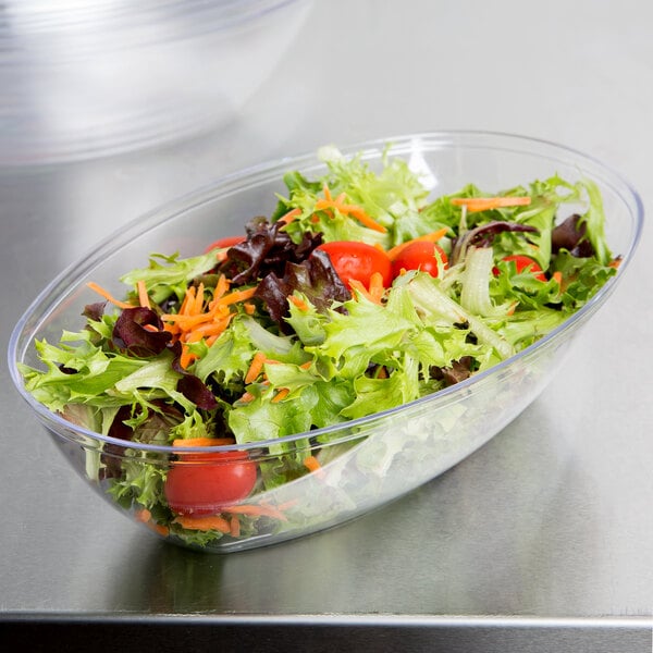 A salad in a clear WNA Comet Luau serving bowl.