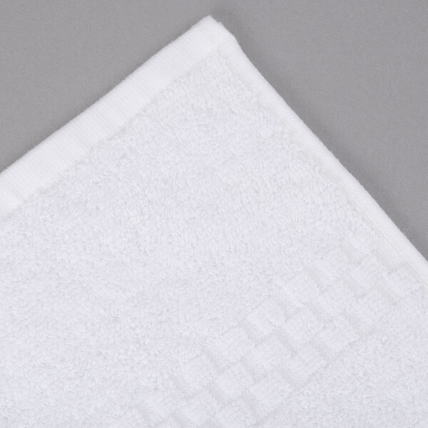 A close-up of a white Oxford Viceroy pool towel with a square design.