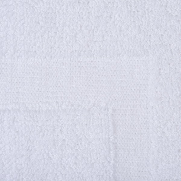 A close up of a white Oxford Regale bathmat with a square dobby border.
