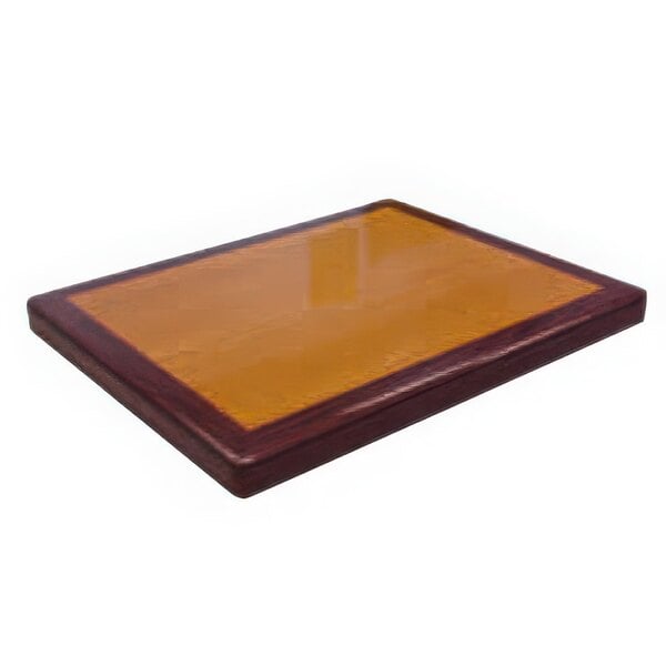 A rectangular American Tables & Seating table top in walnut with a mahogany border.