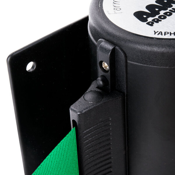 A black wall-mount stanchion with a green retractable belt.