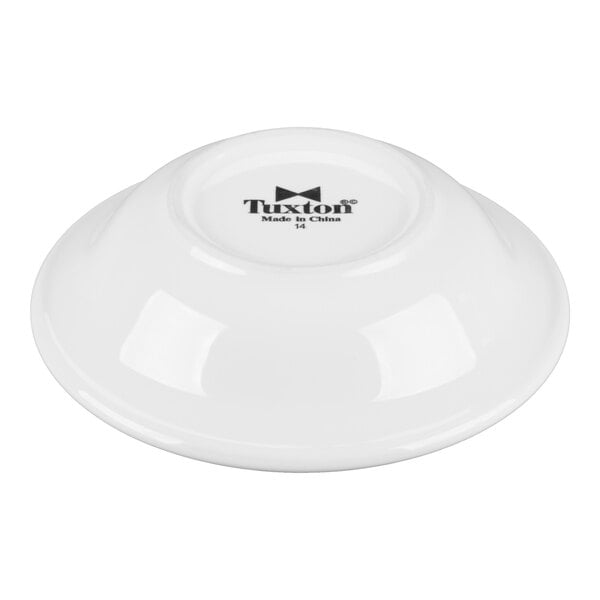 A white Tuxton China monkey dish with black text.