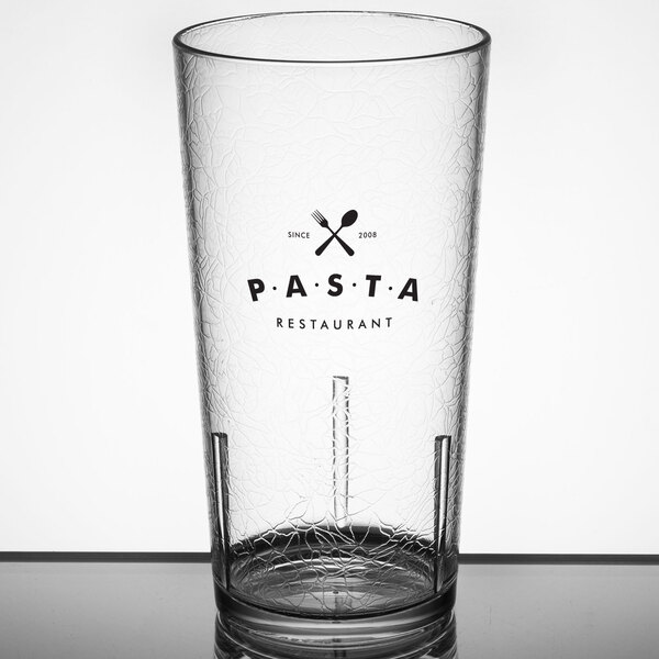A close-up of a clear Cambro plastic tumbler with the word "pasta" on it.