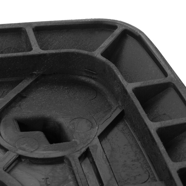 A black plastic jar pad with a hole in it.