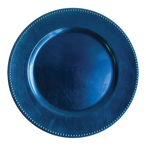 A round royal blue plastic charger plate with a beaded rim.