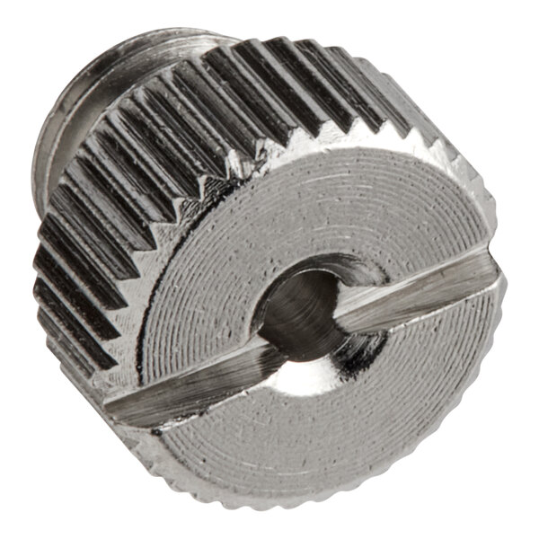 A metal tip with a small hole at the end.