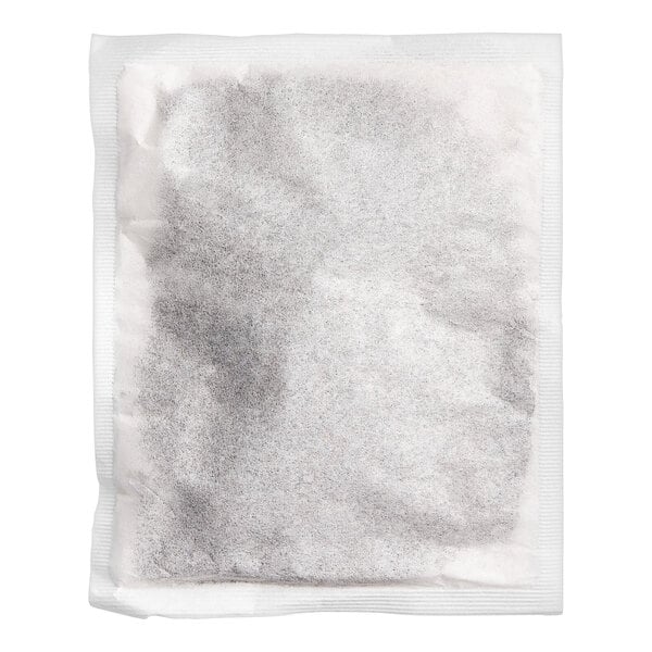 A white paper filter bag with black spots.