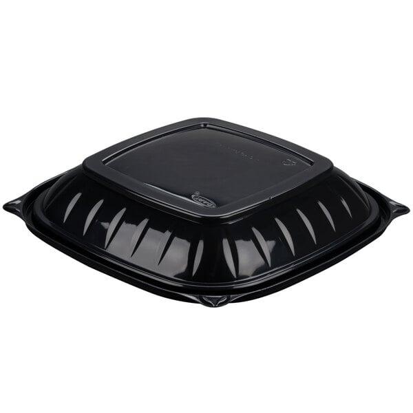 A Dart black square plastic bowl with a lid.