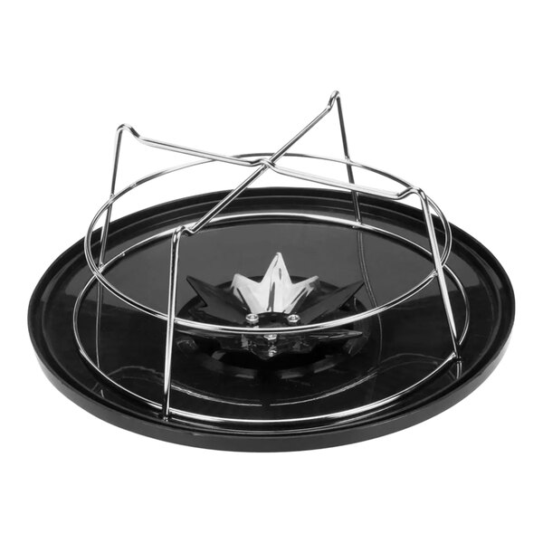 A black circular plastic and metal funnel cover with a basket inside.