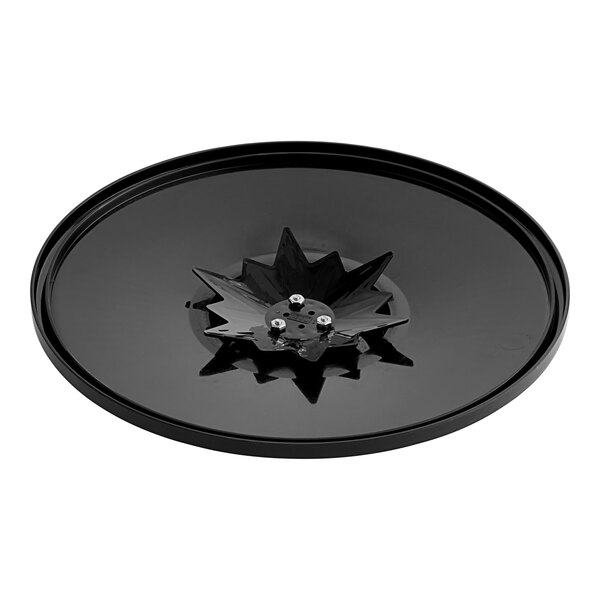 A black plastic circular object with a star design.