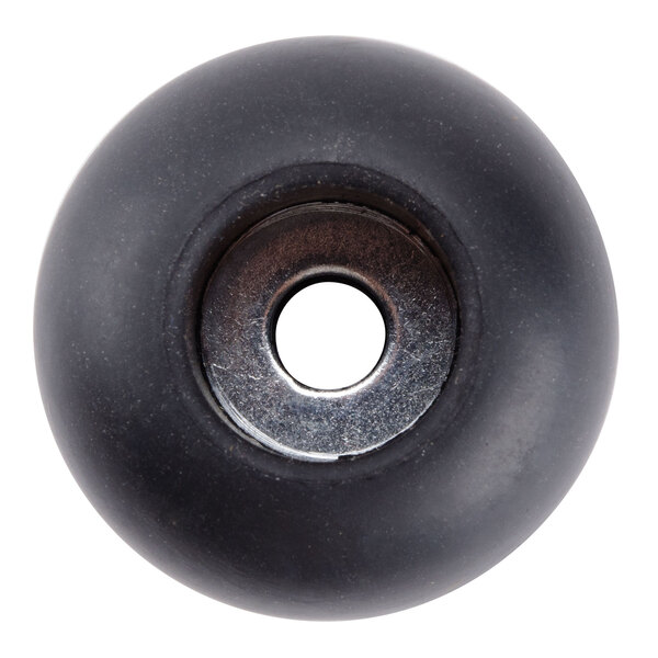 A black rubber round with a hole in it.