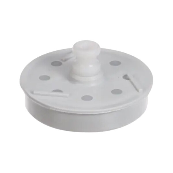 A white plastic impeller with holes.