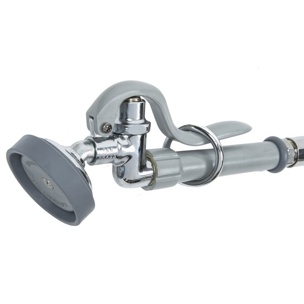 A T&S wall mounted pre-rinse faucet with a hose and angled spray valve.