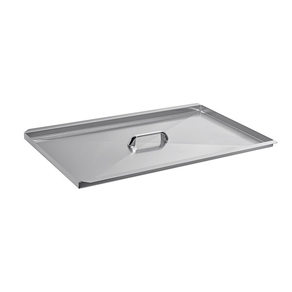 A silver rectangular metal lid with a handle.