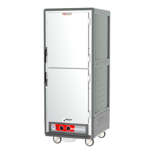 A grey Metro C5 holding cabinet with white solid Dutch doors.