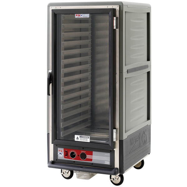 A large grey Metro heated holding cart with a clear door.