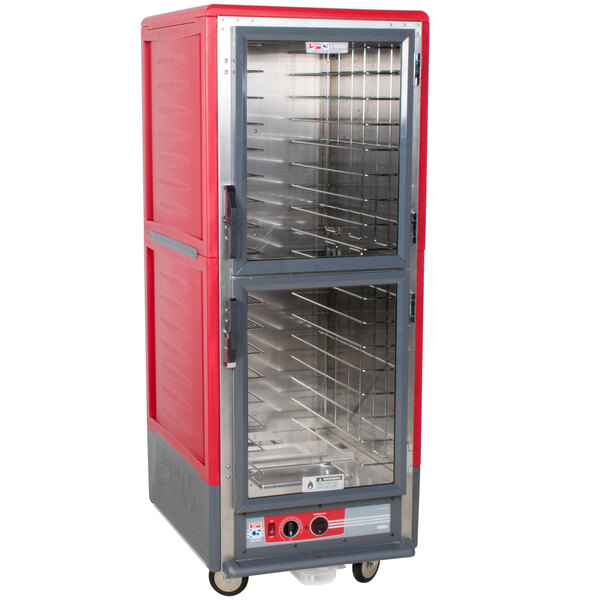 A red and silver Metro C5 hot holding cabinet with clear Dutch doors.