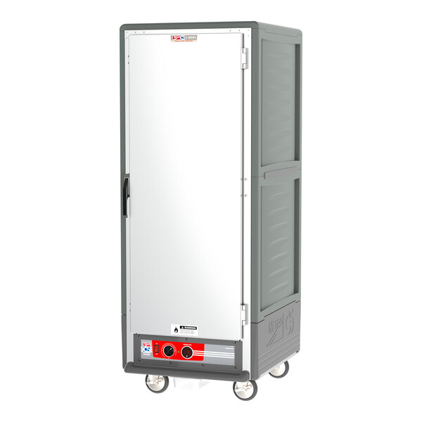 A grey holding cabinet with a white door and black handle.