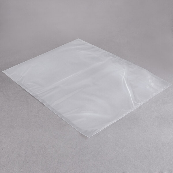 A clear plastic ARY VacMaster vacuum packaging bag on a grey surface.