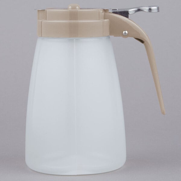 A white plastic Tablecraft syrup dispenser with a brown handle.