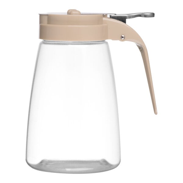 A clear 10 oz. syrup dispenser with an almond-colored ABS top and handle.