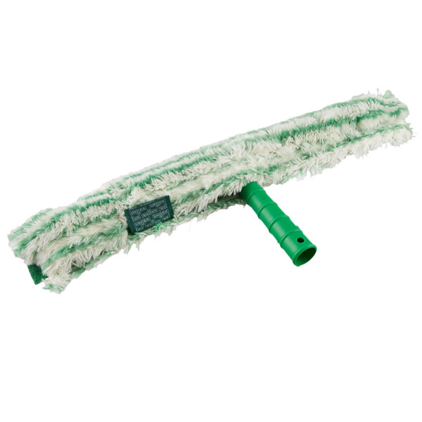 a green mop with a white surface
