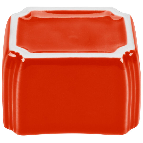 A red and white square Fiesta sugar caddy.
