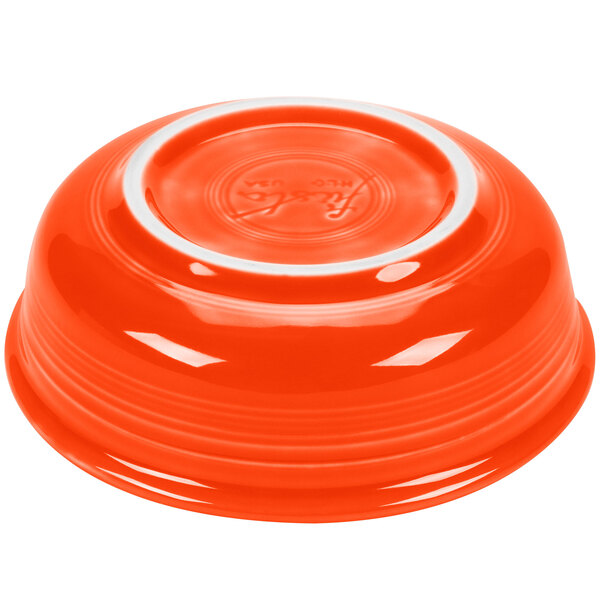 An orange bowl with a white stripe on the rim.