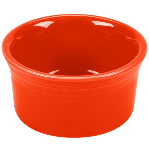 A red Fiesta ramekin with a white interior.