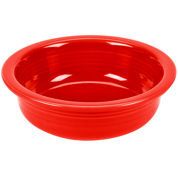 A red Fiesta serving bowl with a white background.