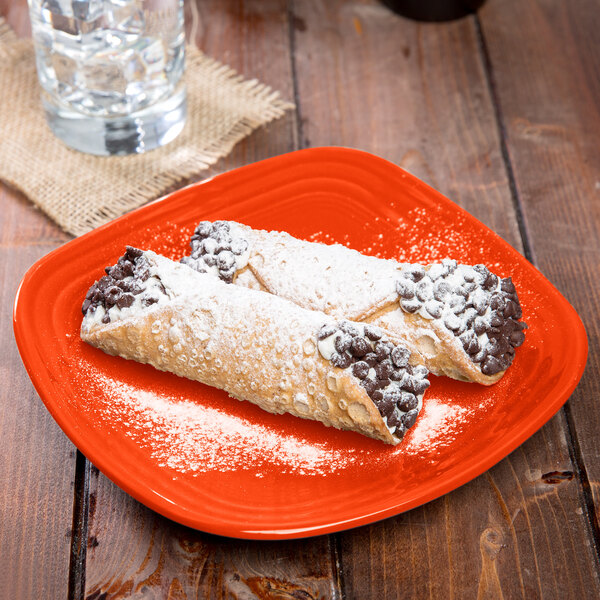 A Fiesta® square china salad plate with food on it.