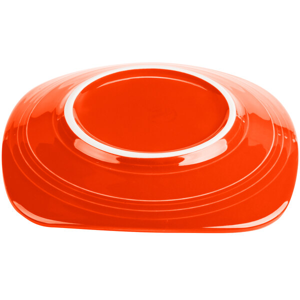 A red plate with a white rim.