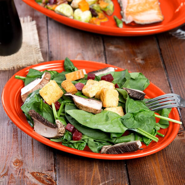 A Fiesta china platter with salad and a fork.