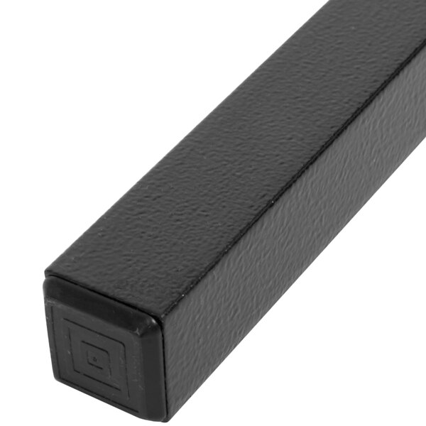 A close-up of a black rectangular Carlisle sneeze guard spar with a square shape on it.