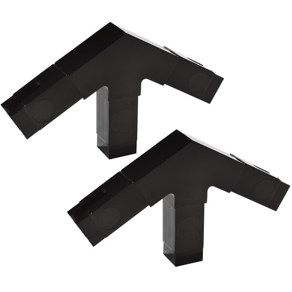 Two black plastic Carlisle corner blocks.