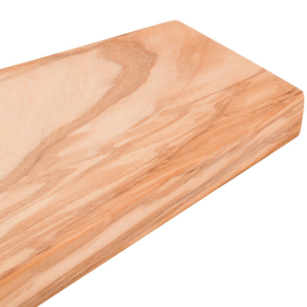 An American Metalcraft olive wood serving board on a table.
