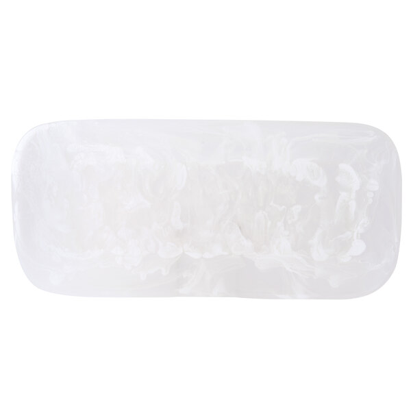 A white rectangular plastic platter with a white flower design.