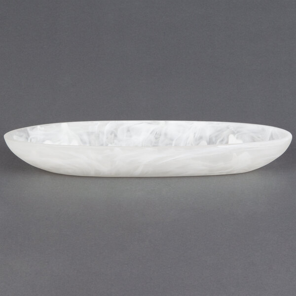 An American Metalcraft white oval bowl on a white surface.