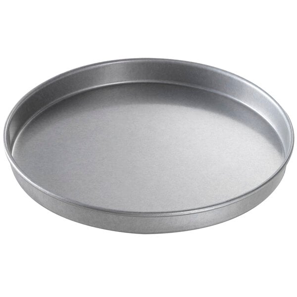 a round metal pan with a round surface