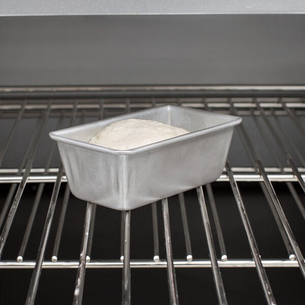A loaf of bread in a Chicago Metallic aluminized steel bread loaf pan.