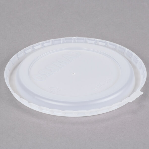 A white plastic lid on top of a translucent plastic lid.